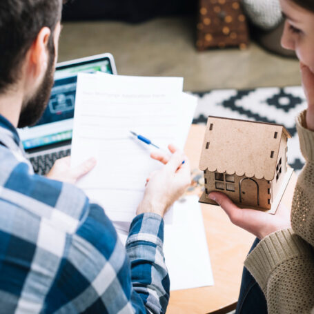 Homebuyers comparing their mortgage rate quotes with a lender