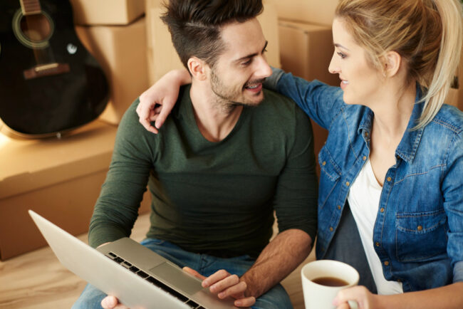 Millennial couple reviewing mortgage options for buying a home in California