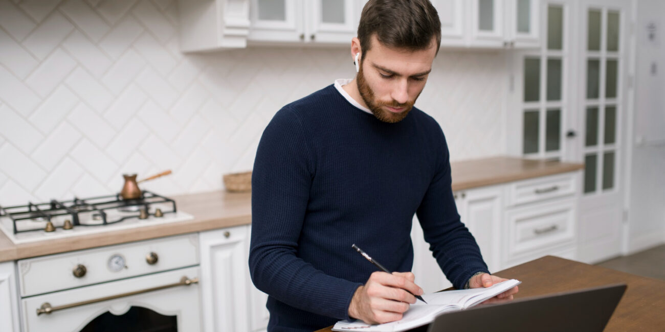 California mortgage refinancing documents reviewed by homeowner at kitchen table