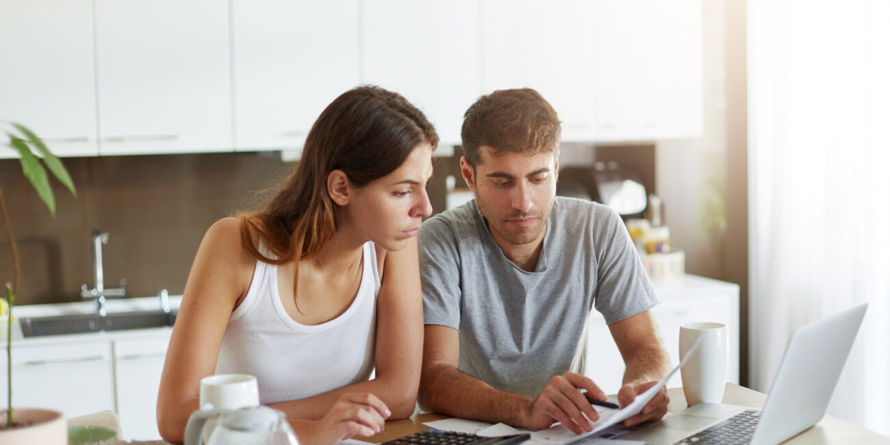 12985 Future buyer reviewing a prepare for homebuying budget and savings plan