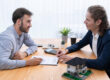 : California home buying discussion with a buyer reviewing mortgage options