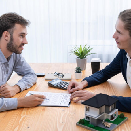 : California home buying discussion with a buyer reviewing mortgage options