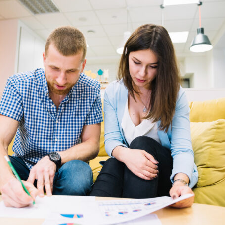 couple planning how long stay home with mortgage advisor