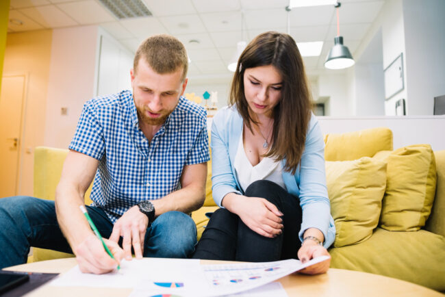 couple planning how long stay home with mortgage advisor