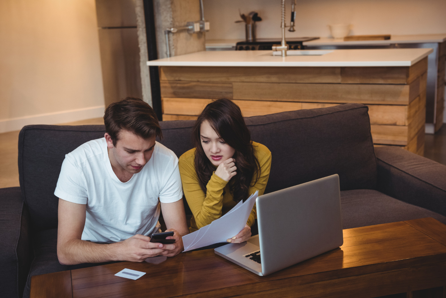 First-time buyers reviewing homeownership costs beyond the mortgage payment