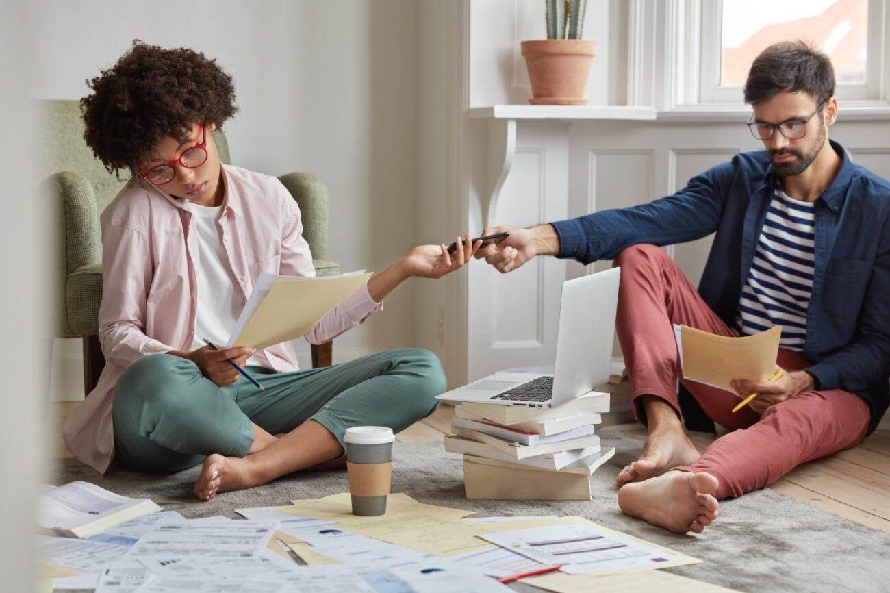 First-time homebuyer reviewing mortgage documents with a professional