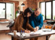 Professionals reviewing homebuying timeline from saving strategy and planning documents