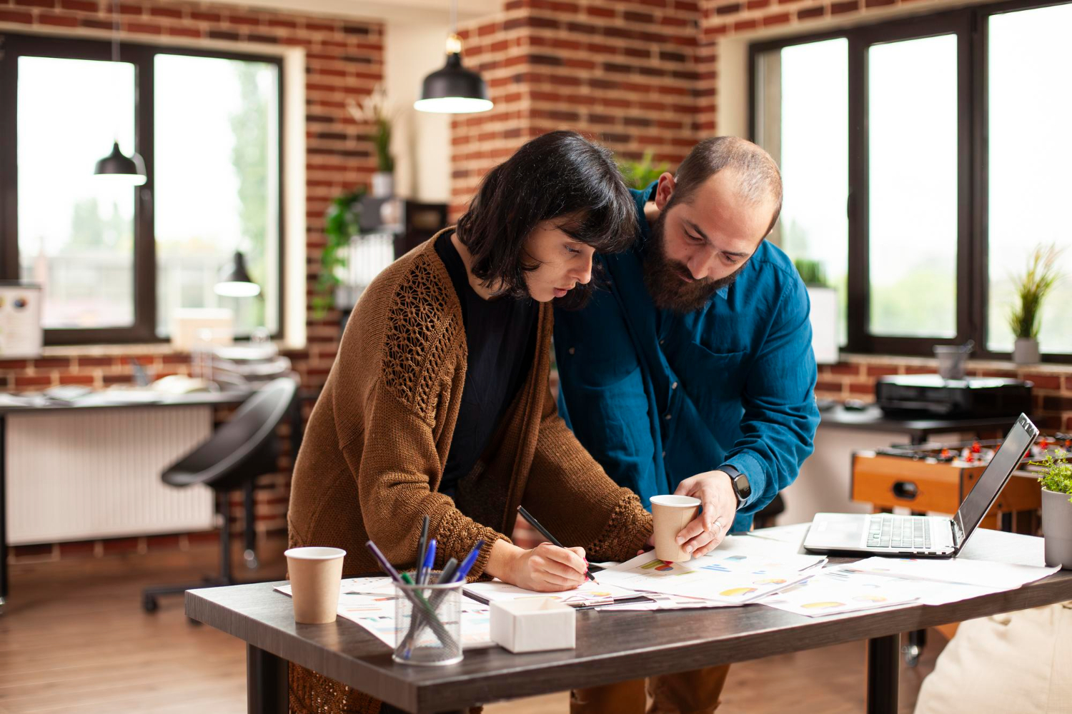 image-homebuying-timeline-from-saving Professionals reviewing homebuying timeline from saving strategy and planning documents
