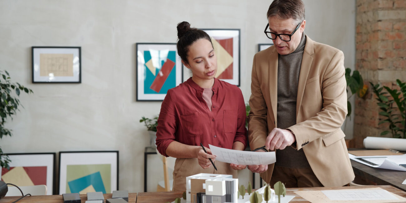 Professionals reviewing how seasonal housing trends strategy and planning documents