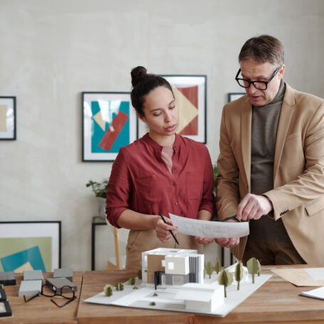 Professionals reviewing how seasonal housing trends strategy and planning documents