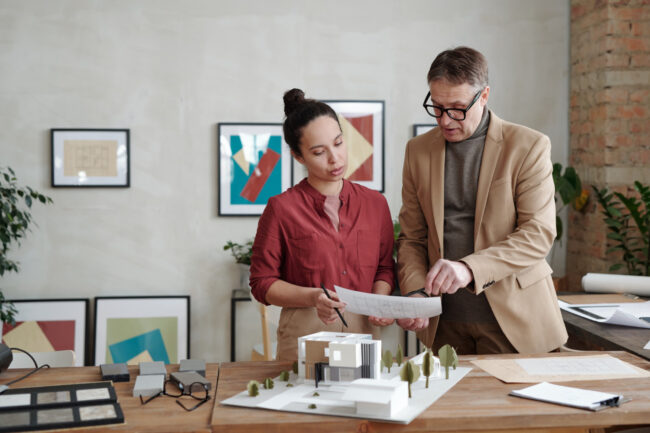 Professionals reviewing how seasonal housing trends strategy and planning documents