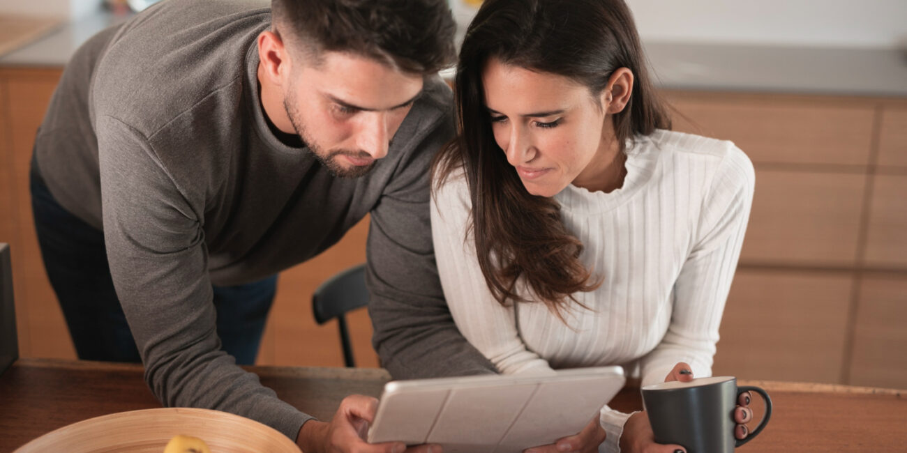 California homebuyers completing a mortgage offer comparison with an advisor