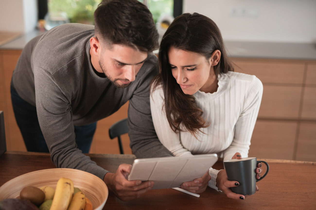 California homebuyers completing a mortgage offer comparison with an advisor